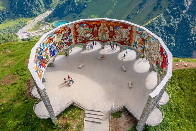 From Tbilisi: Kazbegi Day Tour, Gergeti Trinity, Ananuri &Gudauri - The Russia–Georgia Friendship Monument: Soviet-Era Messaging in Stone