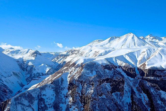 Kazbegi, Gergeti and Ananuri Full Day Tour from Tbilisi - Seaside Park Swimming Pool stop: mineral water, unusual rocks, and a short breather