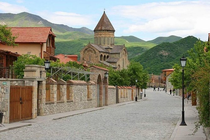 Mtskheta, Ananuri, Gudauri and Kazbegi Full Day Tour from Tbilisi - Gergeti Trinity Church near Kazbegi: the altitude payoff